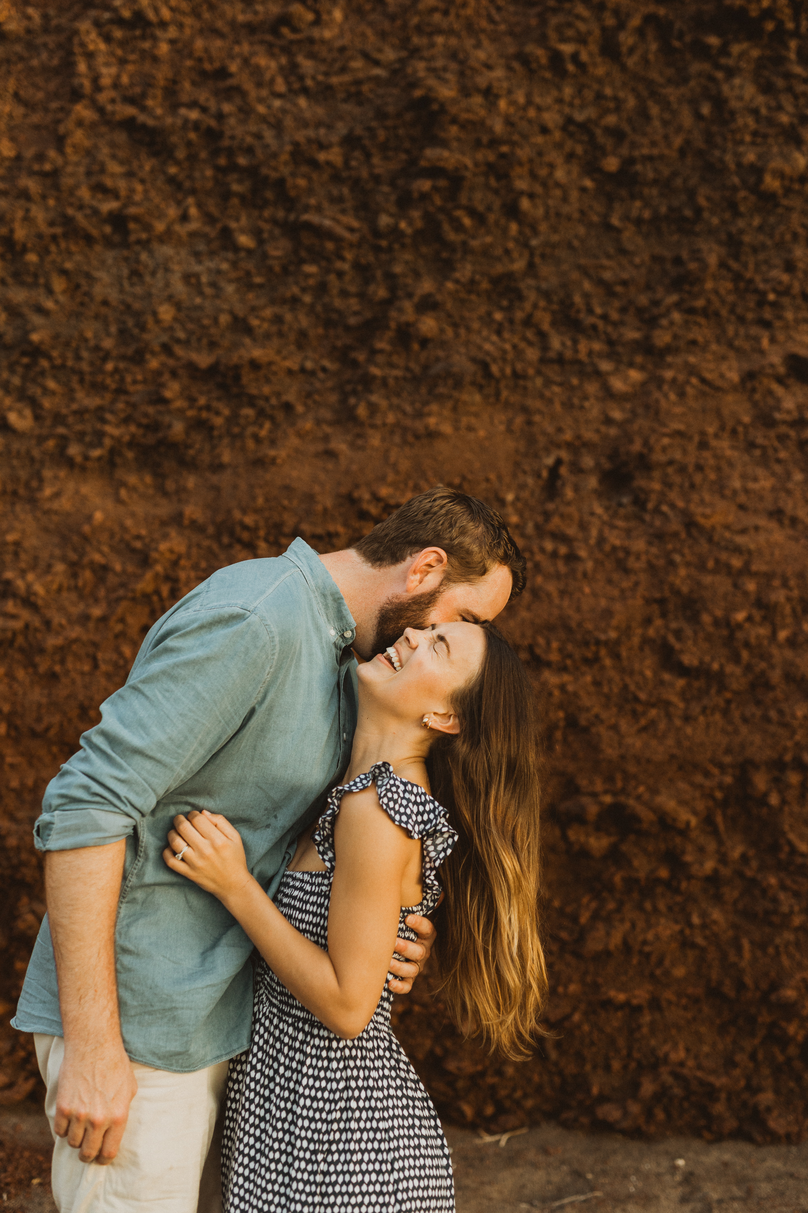 couple laughing and hugging